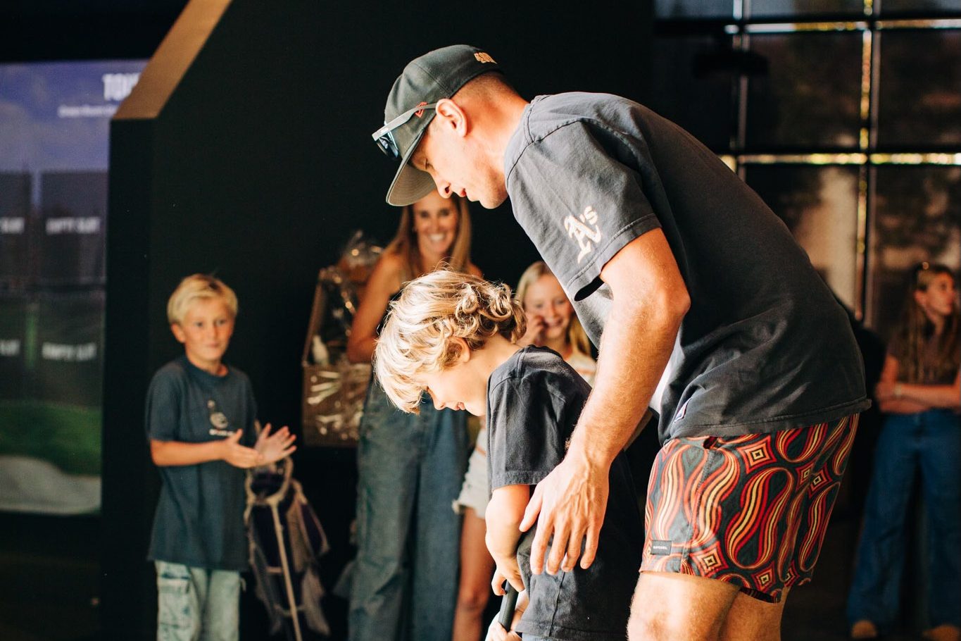 Families putting on the Green Room practice green